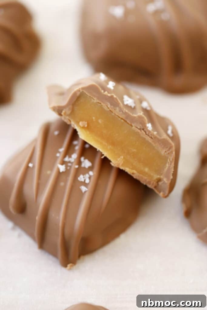 A baking sheet filled with exquisite chocolate covered caramels, perfectly ready to be a highlight of your Halloween menu.