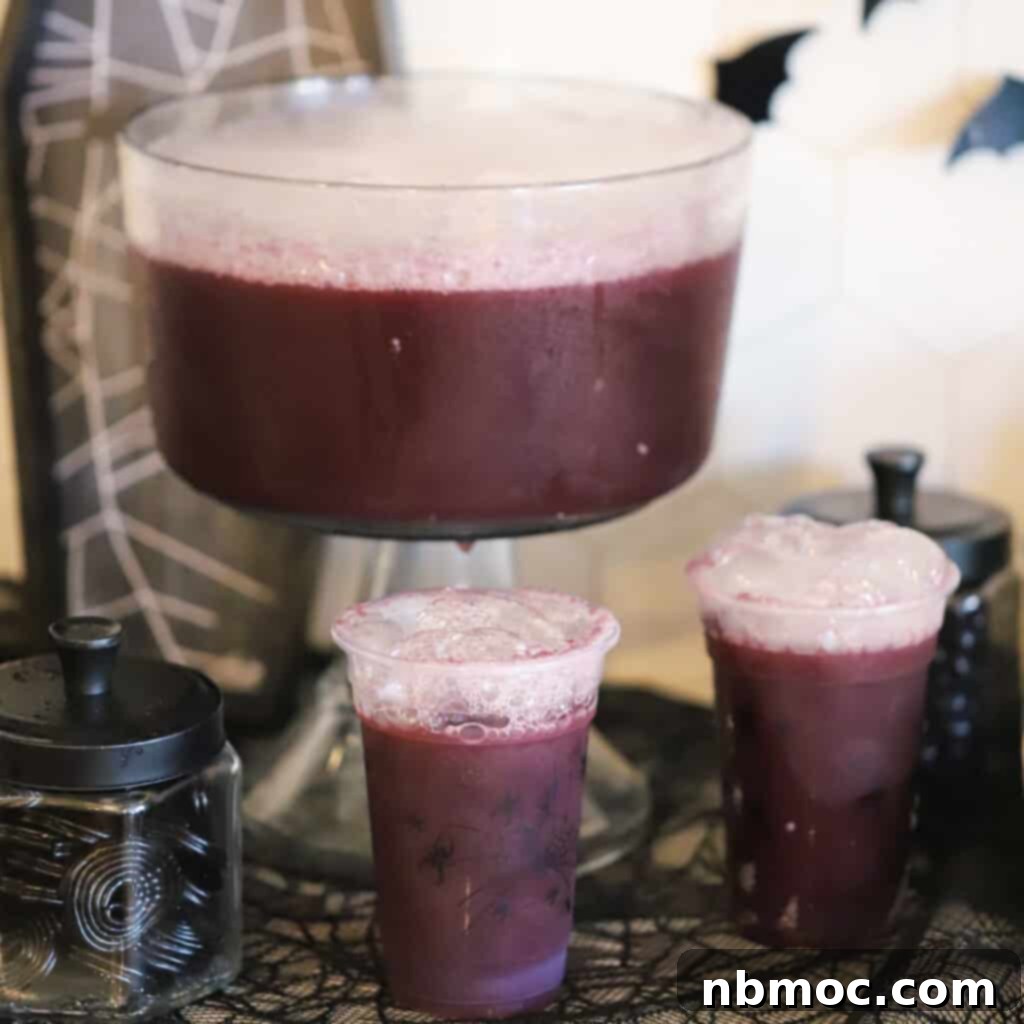 A mystical purple witch punch bubbling on a Halloween-decorated table, creating an alluring and spooky atmosphere.