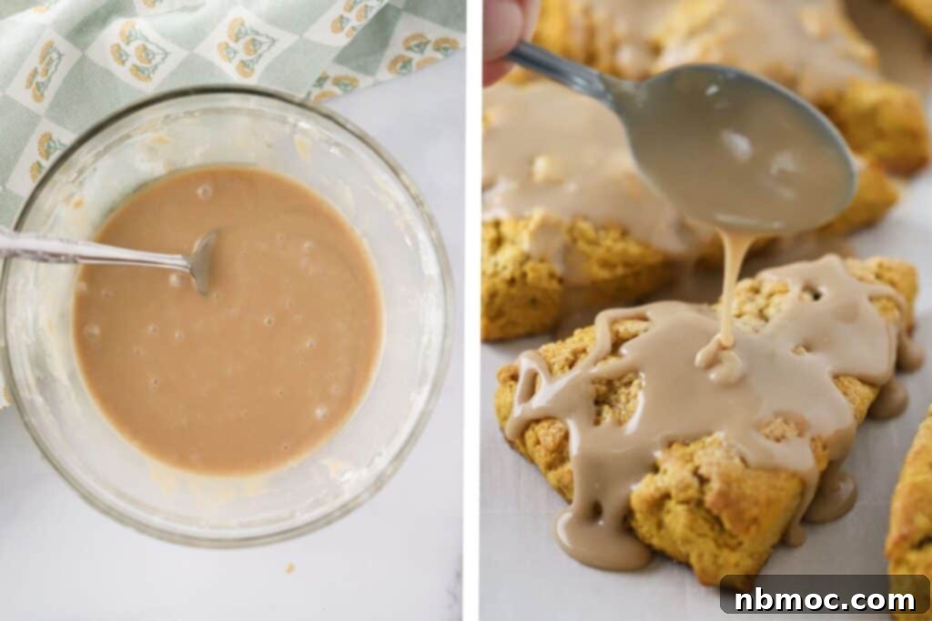 A close-up shot of a hand spooning generous amounts of maple glaze over warm, homemade pumpkin scones.