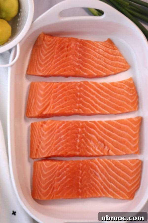 Sticky Teriyaki Salmon Grill 3 Fresh salmon fillets prepared in a white baking dish, ready for marinating to become the perfect Grilled Teriyaki Salmon. Steps to grill teriyaki salmon.