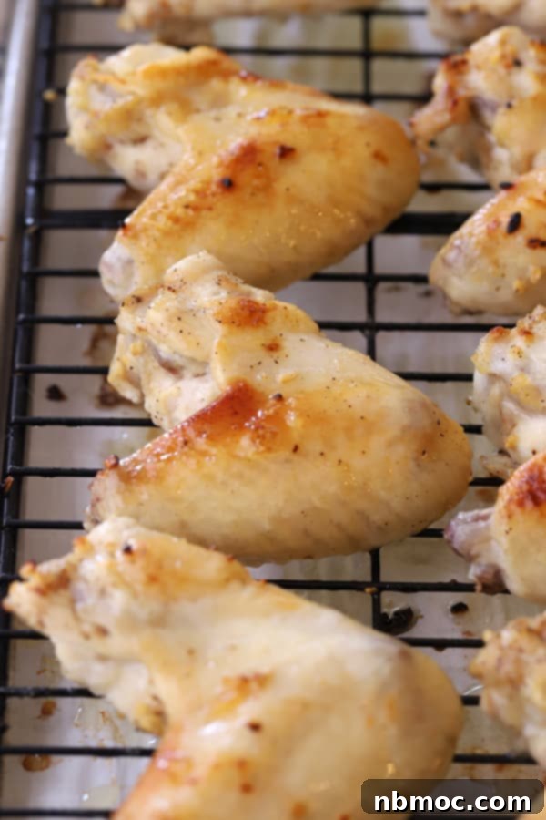 Simple Oven Buffalo Wings 4 Baked whole Chicken wings oven recipe, on a wire rack. how to cook chicken wings in the oven. how long to cook chicken wings in oven. how long to cook wings in oven. oven baked wings.