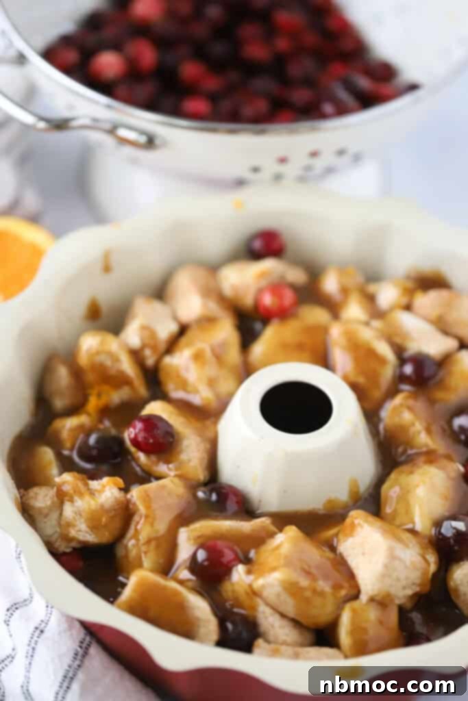 Zesty Cranberry Orange Pull-Apart Delight 6 A bundt pan with the dough for making cranberry orange monkey bread.