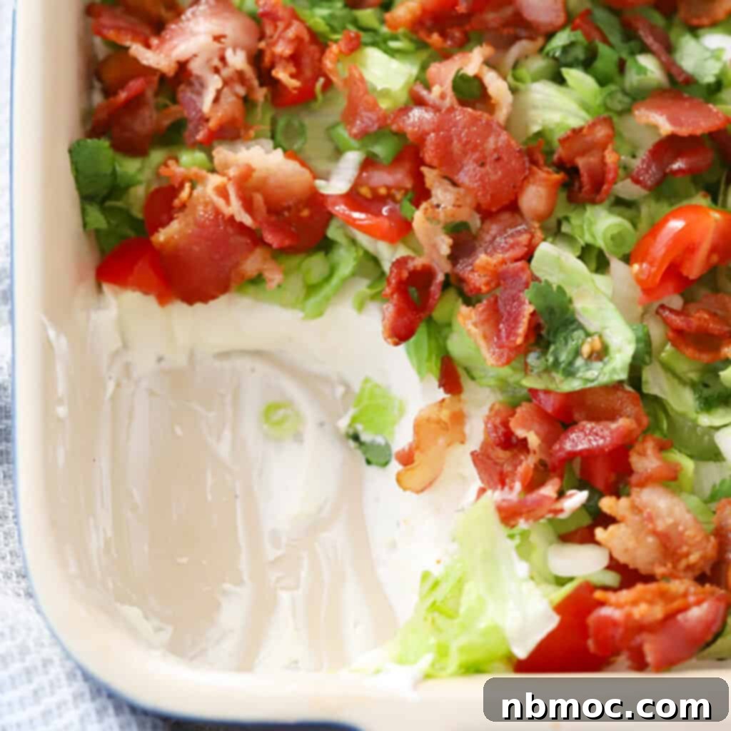 blt dip with bacon on top, an easy bacon appetizer