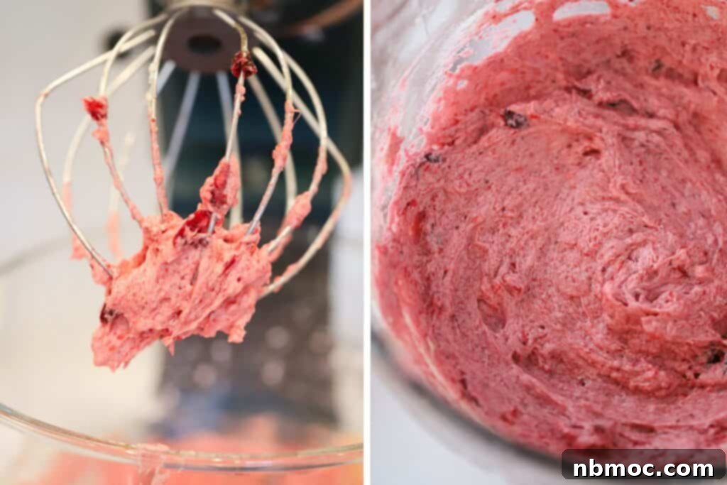 Honeyed Cranberry Cream 3 A close-up shot of fluffy whipped cranberry butter elegantly presented in a decorative bowl, highlighting its rich texture and festive color.