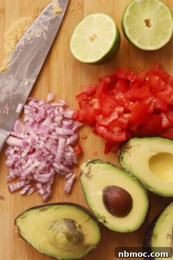 Guacamole ingredients on a wooden cutting board, how to make guacamole. 