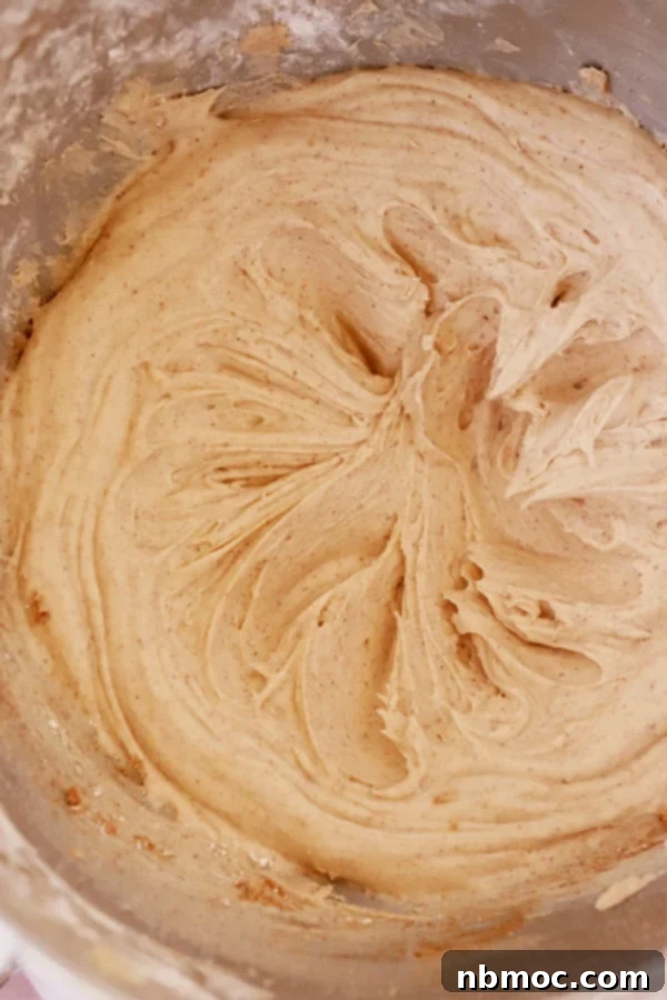 cinnamon buttercream frosting in a large mixing bowl.