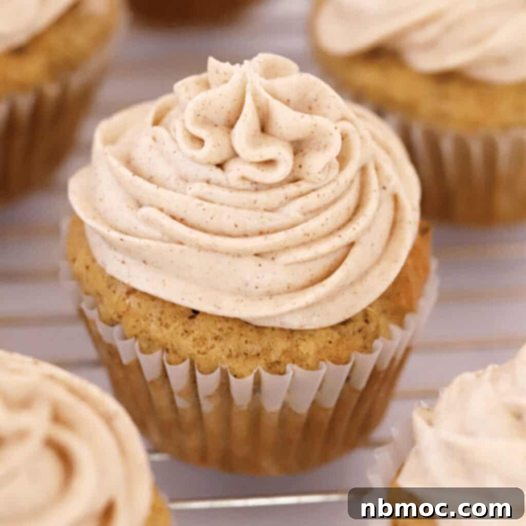 zucchini cupcakes topped with cinnamon icing.