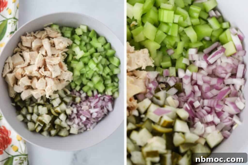A bowl full of chopped ingredients for making chicken salad recipe with pickles and pickle juice.