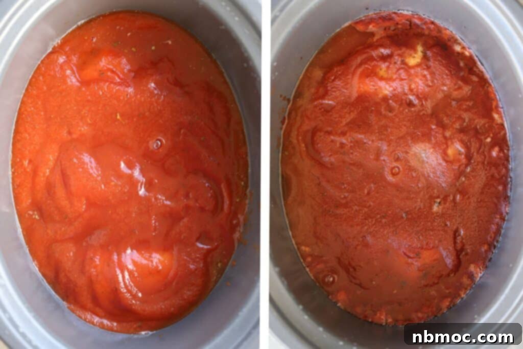 A slow cooker filled with chicken breasts and marinara sauce. 