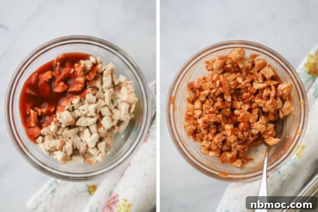 Buffalo Chicken Turnover 4 Diced chicken in a glass bowl tossed in buffalo sauce.