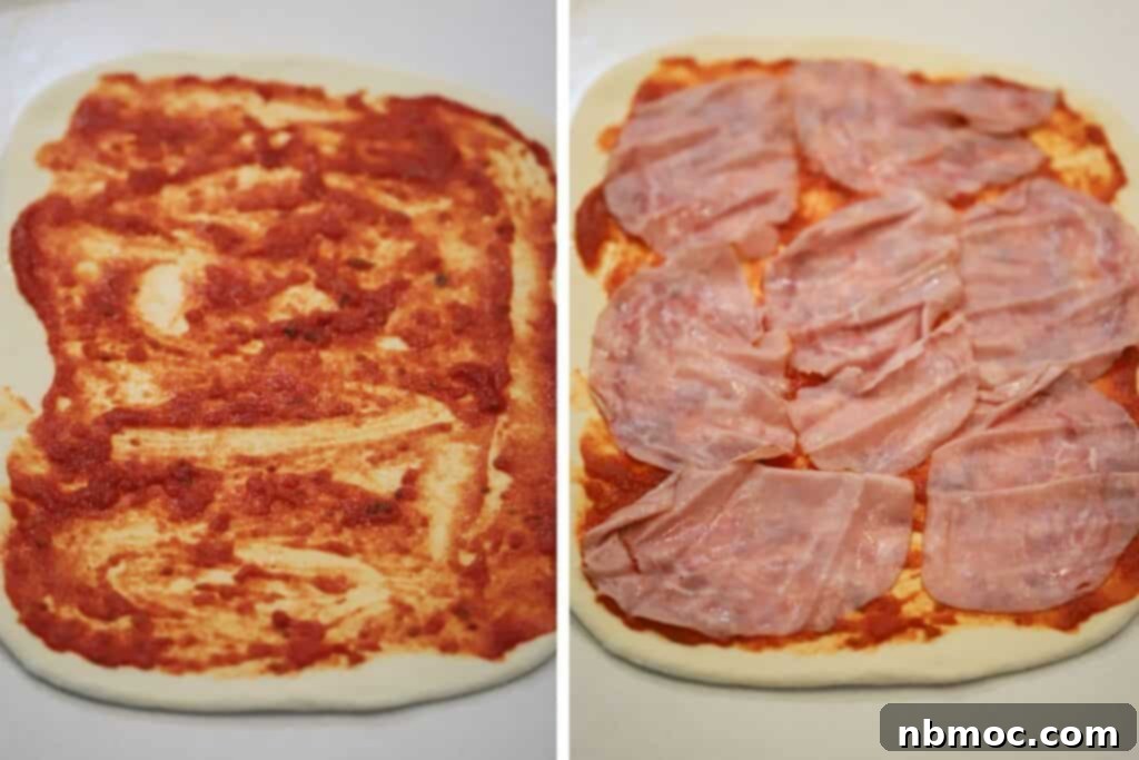 Spreading pizza sauce and sliced meat across rolled out dough.