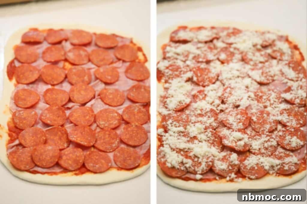 Adding pepperonis and Parmesan cheese across stromboli pizza dough.