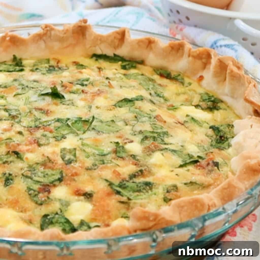 Mediterranean Spinach Feta Quiche 2 A pie plate with spinach and feta quiche with a crimped crust.
