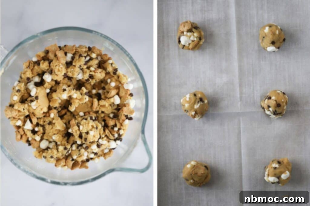 Campfire Smores Delight 4 S'more cookie dough in a glass mixing bowl, ready for baking.