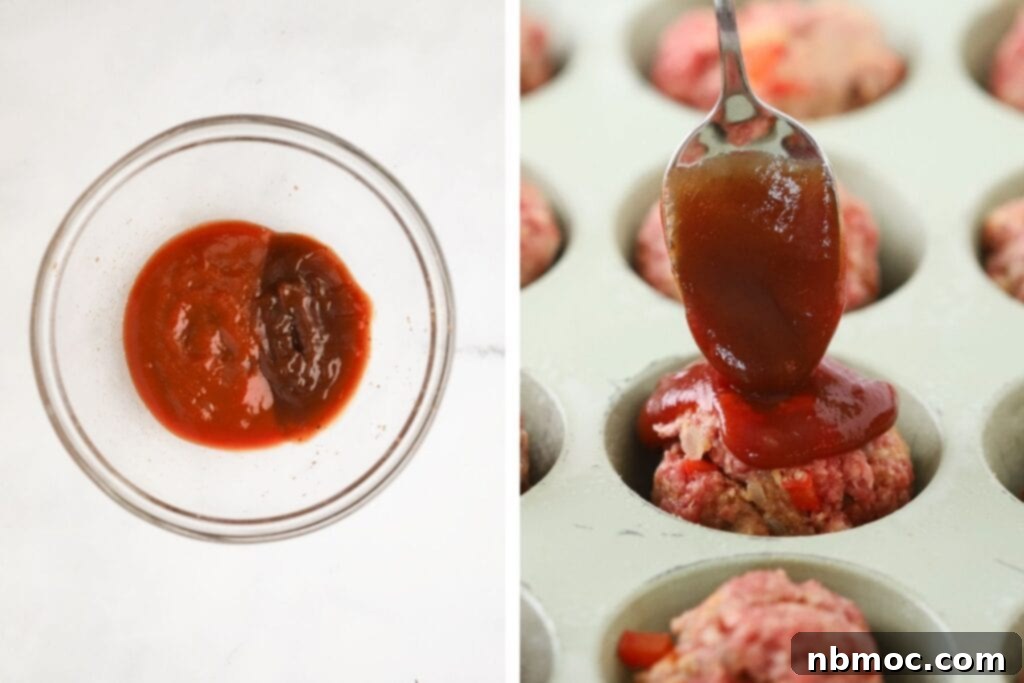 A hand spooning a rich, red glaze of tomato and BBQ sauce over unbaked mini meatloaves nestled in a muffin tin, ready for baking.