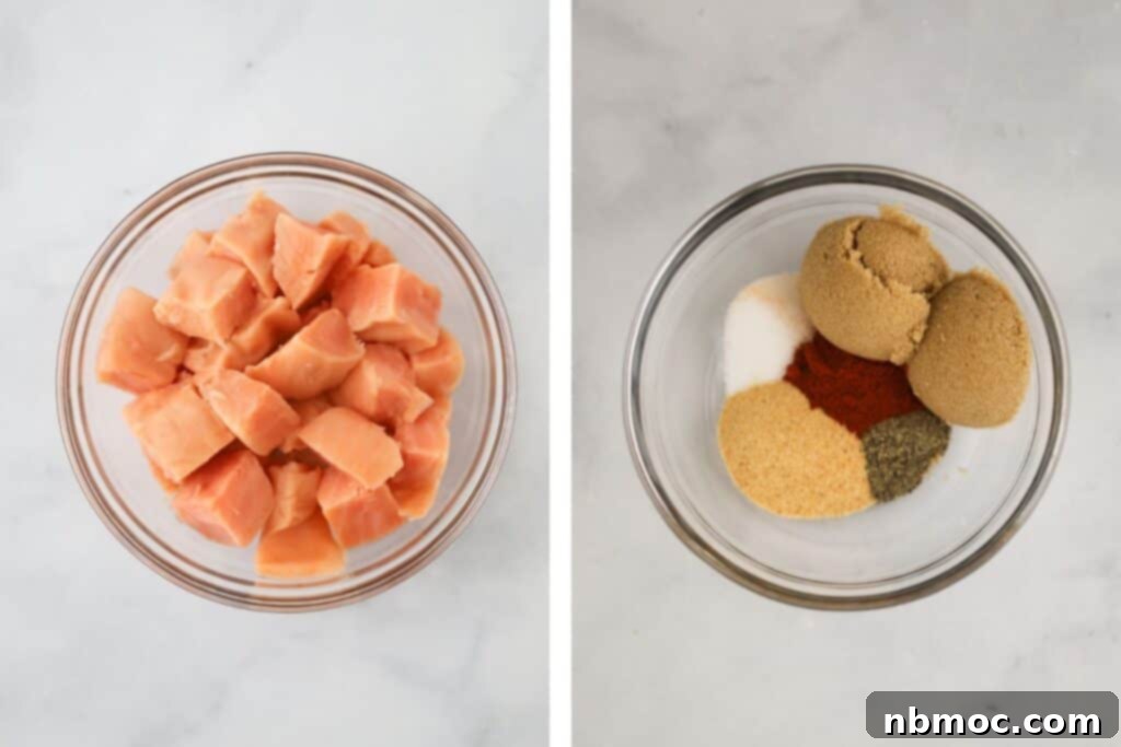 Fresh salmon fillets cut into uniform pieces, alongside a small bowl of spice rub ingredients.