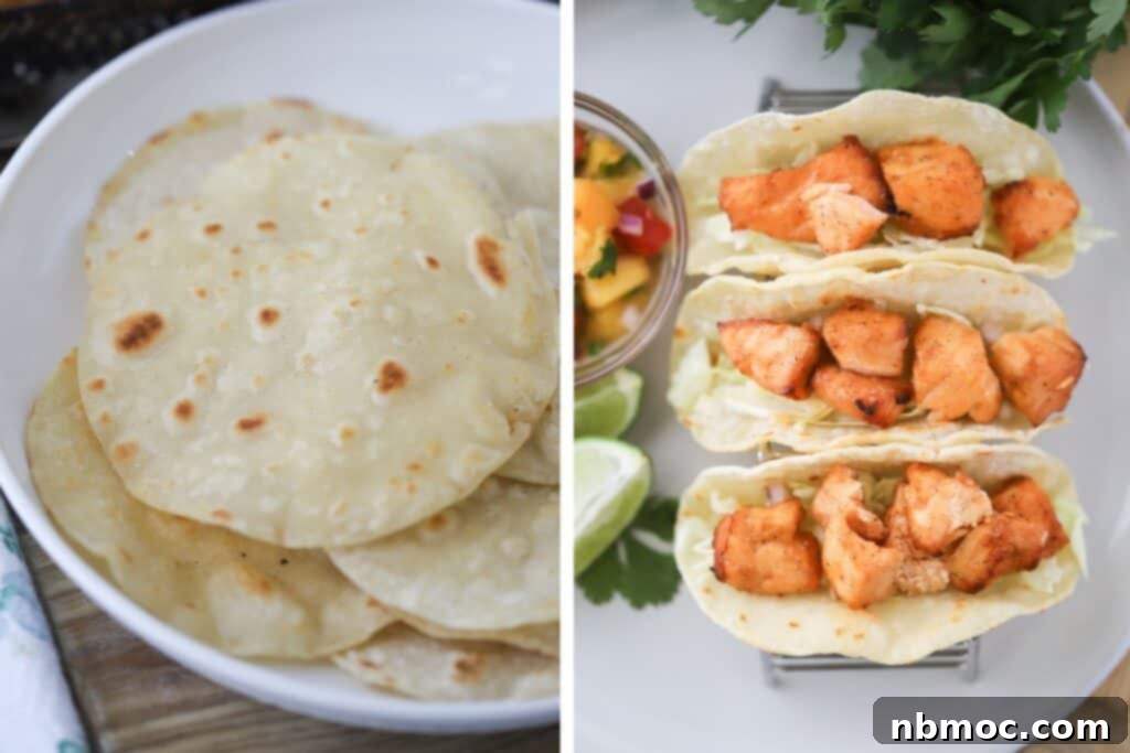 Warm corn tortillas, lightly crisped, loaded up with golden-brown air fryer salmon pieces, ready for the vibrant peach salsa and creamy lime crema.