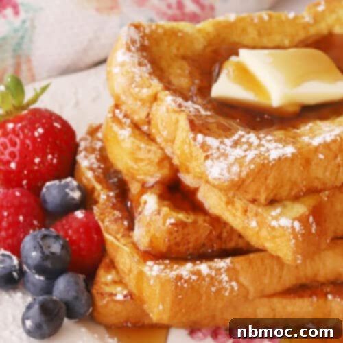 Classic French Toast with berries, butter, and syrup.