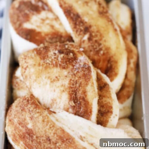 Baked Cinnamon Twist Bread in a loaf pan.