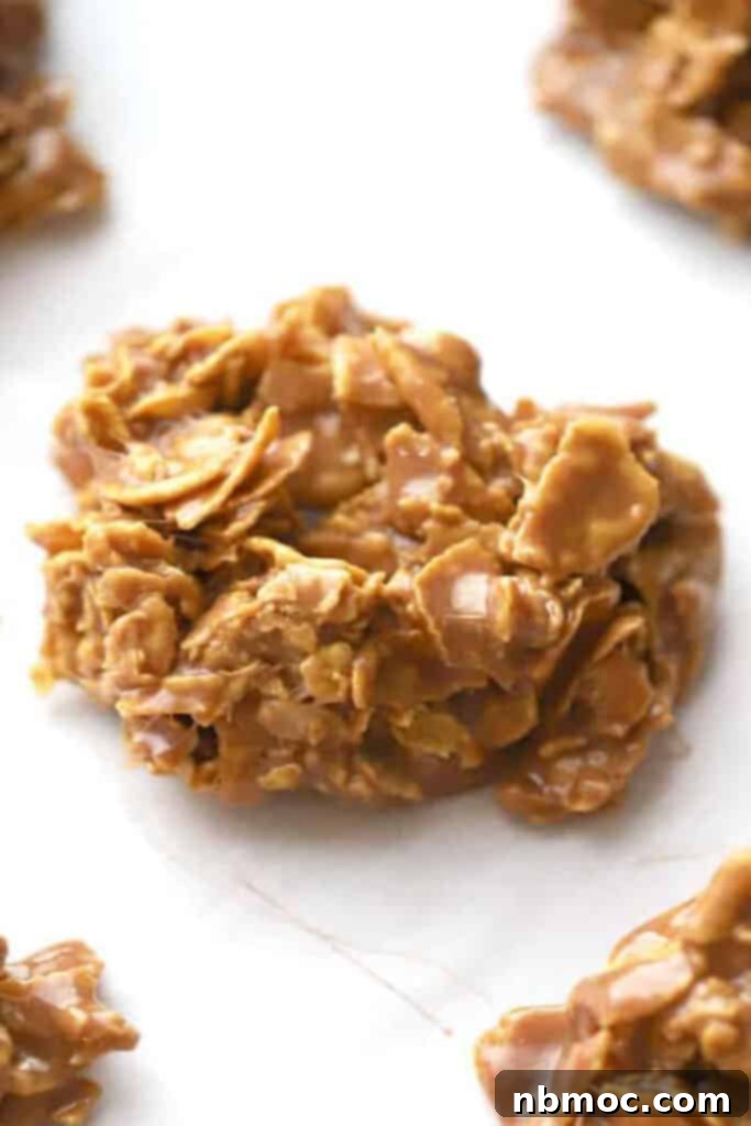 How to make no bake Nutella cookies with cornflakes, corn flakes cookies no bake. Golden, round cookies cooling on a baking sheet.