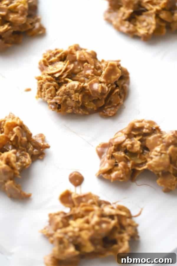 One of the best cookie recipes with Nutella, Nutella cornflake cookies on a white surface, cooling; simple cornflake dessert.