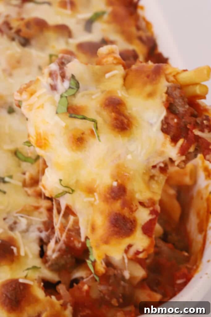 Quick and Comforting Baked Ziti 4 cooked baked ziti recipe, smothered with cheese.