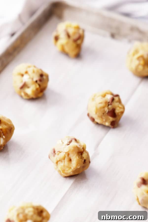 DoubleTree cookie dough prepared on parchment paper, ready to be baked into delicious cookies.