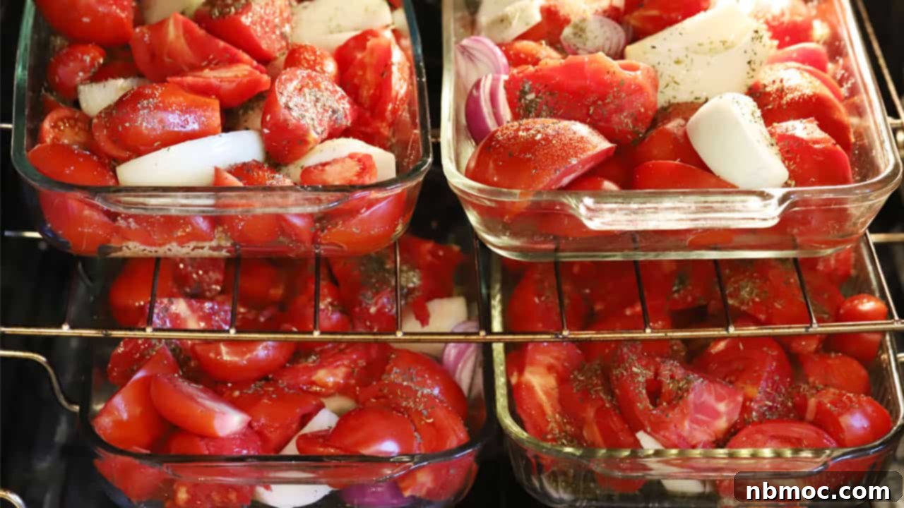 Slow Roasted Garden Tomato Marinara 6 Four glass baking dishes filled with tomatoes and onions, oven roasting for homemade marinara sauce.