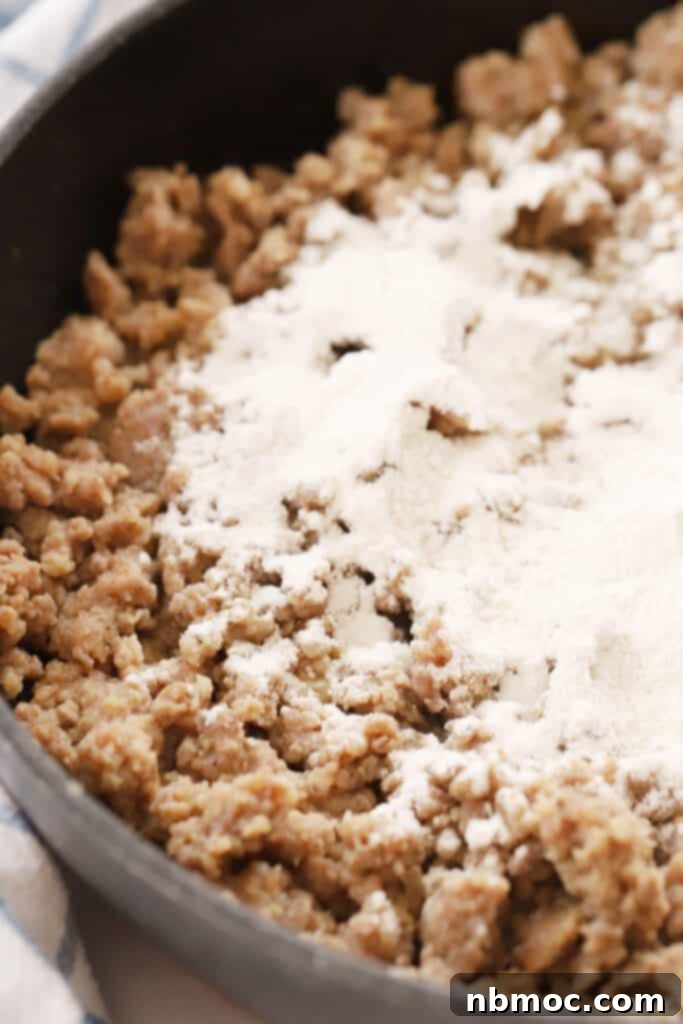 Cooked sausage combined with flour mixture, forming a roux for the gravy.