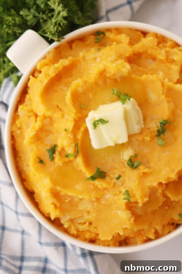 Velvety Root Puree 2 mashed root vegetables in a white bowl with a pat of butter