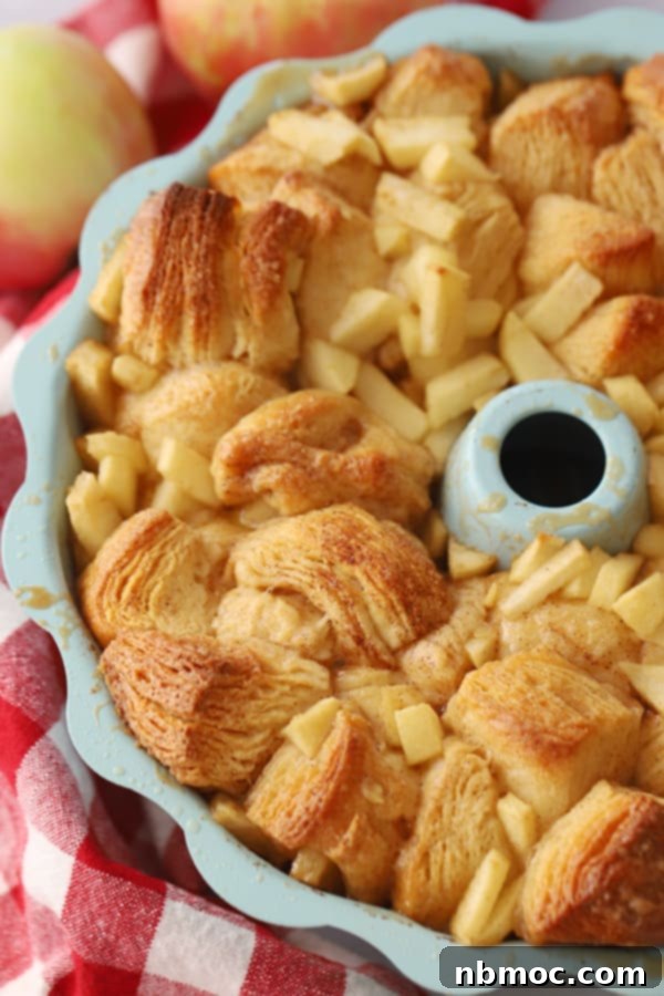 Warm Spiced Apple Monkey Bread 2 A bundt pan with baked caramel Apple Monkey Bread, golden brown and glistening with caramel.