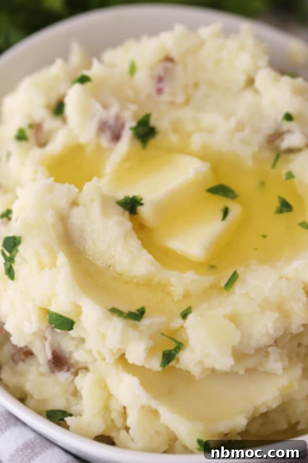 Ruby Red Mashed Potatoes 5 A bowl of mashed red potatoes, topped with a melting pat of butter, ready to be savored.