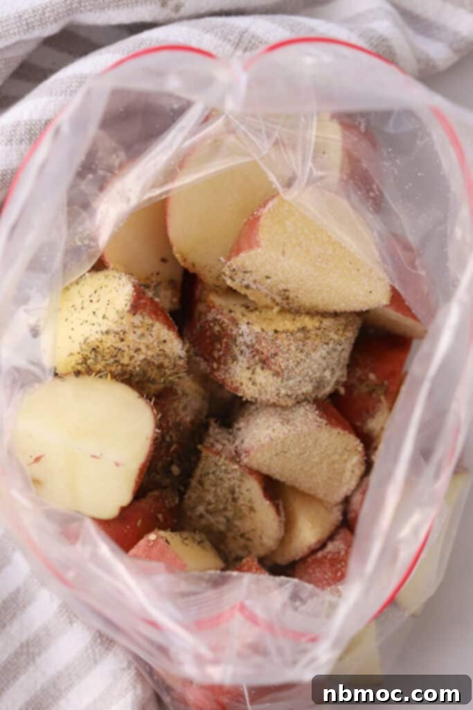 Crispy Air Fryer Red Potatoes 4 A ziplock bag filled with quartered potatoes and seasoning.