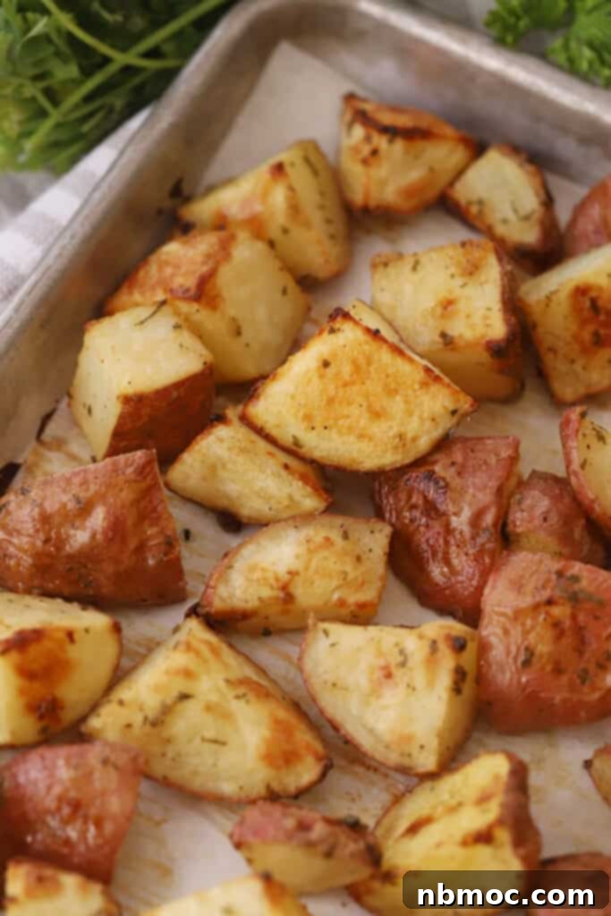 Golden Roasted Red Skinned Potatoes 2 Crispy roasted red potatoes on a baking sheet.