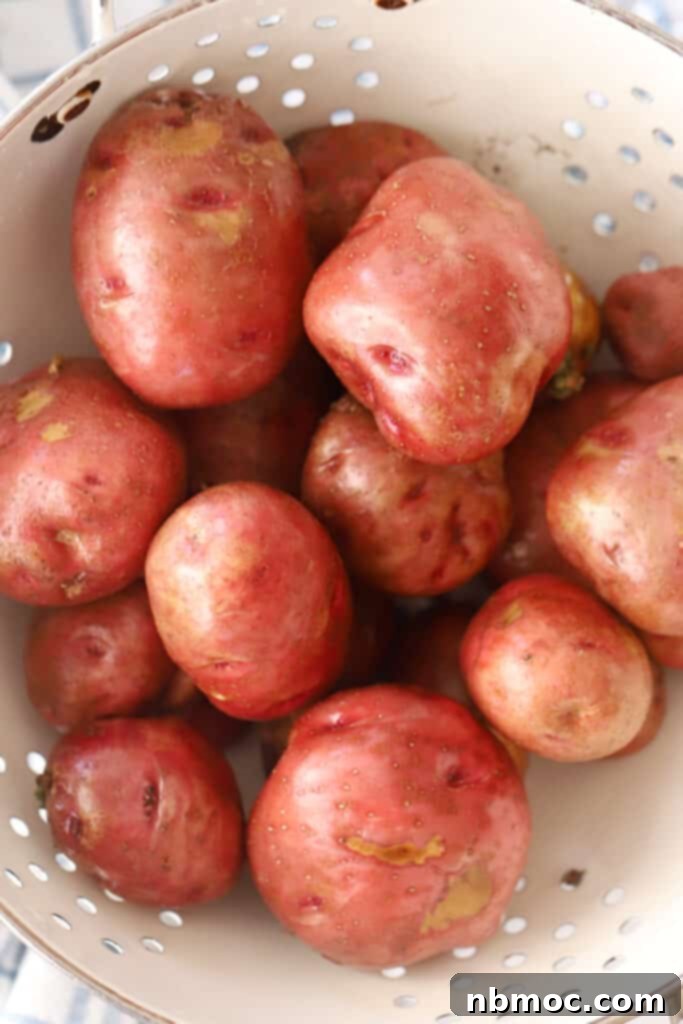 Golden Roasted Red Skinned Potatoes 3 Red skin potatoes in a collander.