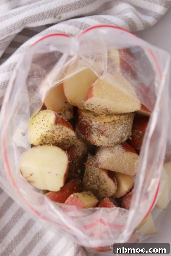 Golden Roasted Red Skinned Potatoes 4 A freezer bag with cut up red potatoes and seasoning.